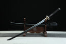 Sword on a wooden stand with a black background