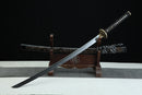Sword on a wooden stand with a black background