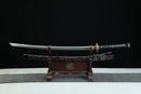 Sword on a wooden stand with a black background
