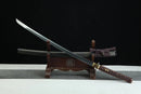 Sword on a wooden stand with a dark background