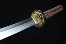 Sword with decorative hilt on a black background