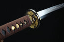 Decorative sword with gold embellishments on a dark background