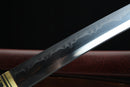 Close-up of a sword blade with a dark background