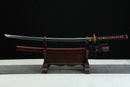Sword on a wooden stand with a dark background