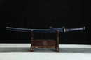 Sword on a wooden stand with a black background