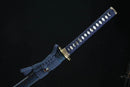 Sword with a blue sheath featuring gold accents on a black background