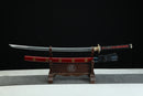 Sword on a wooden stand with a black background