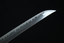 Close-up of a sword blade on a black background