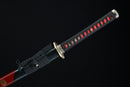 Sword with black and red handle on a black background