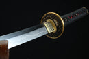 Sword with gold handle and black sheath on a dark background