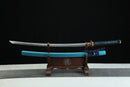 Sword with blue blade on a wooden stand against a black background