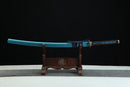 Blue sword on a wooden stand against a black background