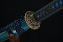 Decorative sword with blue and black scabbard on a dark background