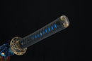 Sword with blue and gold handle on a black background