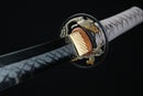 Close-up of a Japanese sword on a dark background