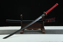 A close-up view of Moonswords Kafuun Katana, with a red handle, featuring intricate designs and patterns.