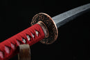 A photo of Moonswords Kafuun Katana with a red bronze guard, is shown against a black background.