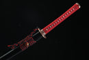 A close-up view of Moonswords Kafuun Katana, with a red handle, featuring intricate designs and patterns.