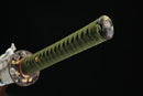 A close-up view of Moonswords Kyochiku Katana with bronze guard and green handle.
