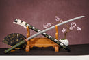 A close-up view of Moonswords Kyochiku Katana, with a white handle and green accents, featuring intricate designs and patterns.