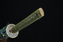 Close-up of the golden kashira, or the pommel cap of Kyojin katana