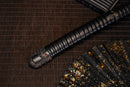 A close-up view of Moonswords Black Mortal Blade Odachi with bronze guard, white handle and black shealth.