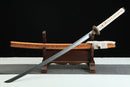 A close-up view of Moonswords Nichirin Katana, with a white handle and orange accents, featuring intricate designs and patterns.