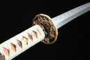 A photo of Moonswords Nichirin Katana with a Silver and Gold-gilded guard, is shown against a black background.