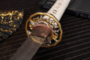 A photo of Moonswords Nichirin Katana with a bronze guard, is shown against a dark, slatted bamboo mat background.