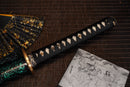 A close-up view of Moonswords Ryokuya Ichirin Katana with bronze guard, black handle and green shealth.