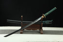 A close-up view of Moonswords Suihyou Katana, with a green handle and black accents, featuring intricate designs and patterns.