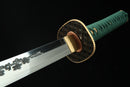 A photo of Moonswords Suihyou Katana with a gold-gilded bronze guard, is shown against a dark background.