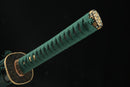 A close-up view of Moonswords Suihyou Katana with bronze guard and green handle.