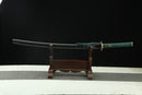 A close-up view of Moonswords Suihyou Katana, with a green handle and black accents, featuring intricate designs and patterns.