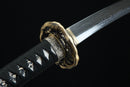 Aged bronze tsuba guard of Tengyaku tanto featuring traditional Japanese metalwork with authentic patina finish