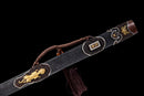 Close-up of the black shealth of the Qianqing sword against a black background