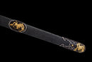 Close-up of the black shealth of the Qianqing sword against a black background
