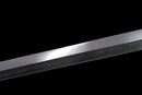 A close-up of the Hand-Forged Laminated Steel blade on the Qianqing sword against a black background