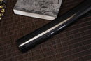 A close-up view of Moonswords Toga Wakizashi with black shealth.