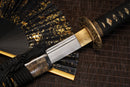 A close-up view of Moonswords Toga Wakizashi with textures on the blade and intricate black designs on the handle.