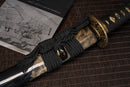 A close-up view of Moonswords Toga Wakizashi with bronze guard, black handle and shealth wrapped in real rayskin.