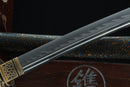 Close-up of a sword with a dark background