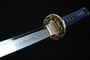 Sword with a blue handle and gold guard on a black background