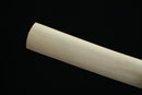 Wooden cylindrical object on a black background