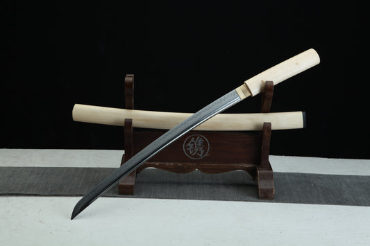 Sword on a wooden stand with a black background
