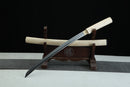Sword on a wooden stand with a black background