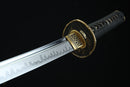A close-up view of a Japanese sword with a black handle and gold accents, including a decorative blade and a decorative piece on the blade.