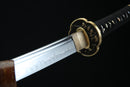 Moonswords wakizashi featuring a clay tempered T10 steel blade, aged bronze tsuba and menuki, real fish skin tsuka, and a solid wood saya in red