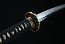 Moonswords wakizashi featuring a clay tempered T10 steel blade, aged bronze tsuba and menuki, real fish skin tsuka, and a solid wood saya in red