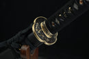 Moonswords wakizashi featuring a clay tempered T10 steel blade, aged bronze tsuba and menuki, real fish skin tsuka, and a solid wood saya in red